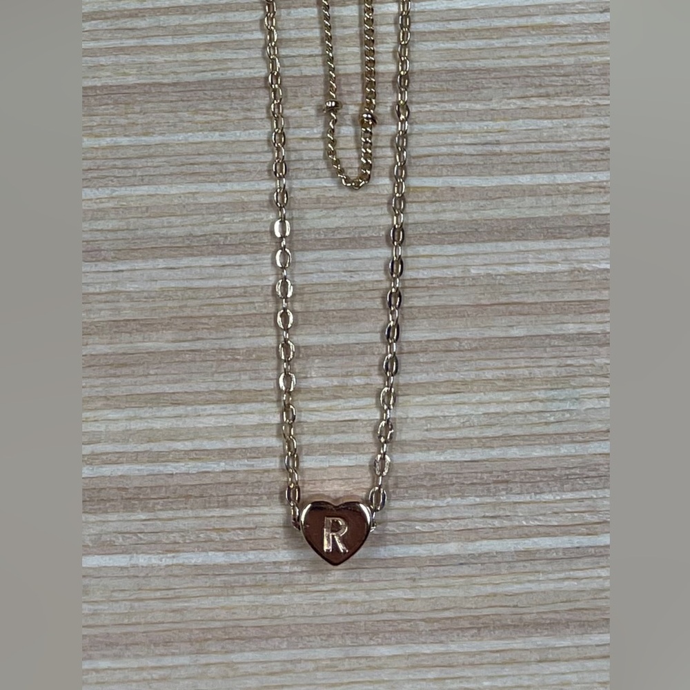 Doubled heart shaped “R” necklace.